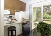 Thumbnail 5 of 28 - Dining and Kitchen Area at Eucalyptus Grove Apartments, Chula Vista, CA, 91910